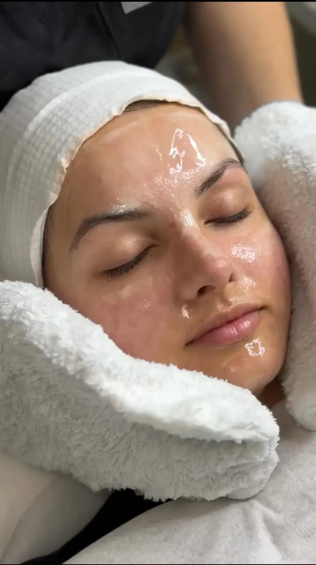 A client relaxing with glowing, freshly treated skin